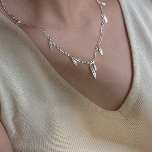 Elegant S925 sterling silver tassel necklace with matte teardrop pendants on a fine chain