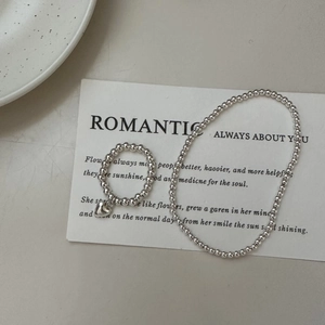 Minimalist S925 sterling silver beaded ring and bracelet set with a heart charm on card
