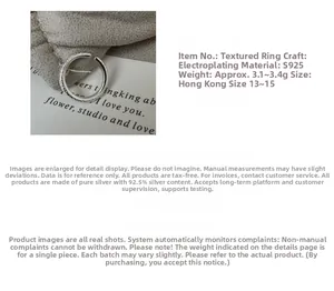 Close-up of S925 sterling silver ring featuring a unique textured surface and polished finish