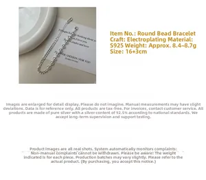 Detail showing S925 sterling silver beaded Cuban chain link bracelet texture and weight