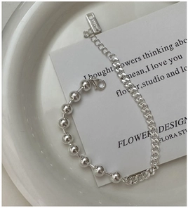 Detail of S925 sterling silver beaded Cuban chain bracelet with AG925 hallmark tag