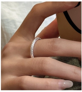 Detailed close-up of textured S925 sterling silver hammered narrow ring band for women
