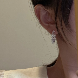 Minimalist S925 sterling silver hoop earrings with sparkling textured finish on model