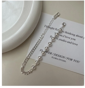 Detail of S925 sterling silver beaded Cuban chain bracelet with Ag925 hallmark