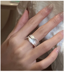 Detail showing wavy textured surface on a S925 sterling silver minimalist ring