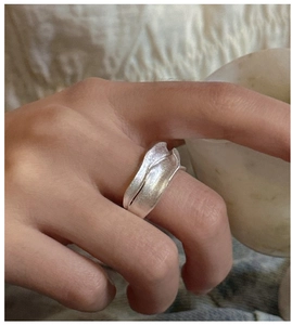 Detailed view of S925 silver ring featuring a unique matte brushed texture and wavy edge