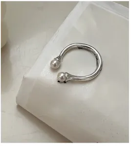 Detailed view of an 8mm pearl ring with an adjustable S925 sterling silver open band