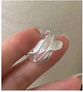 Macro shot of S925 sterling silver ring with organic wavy texture and matte finish