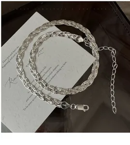 Detail of S925 sterling silver triple-strand braided necklace with Italy 925 hallmark