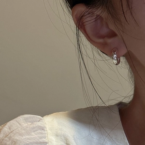 Minimalist S925 sterling silver hoop earrings with a textured irregular lava design