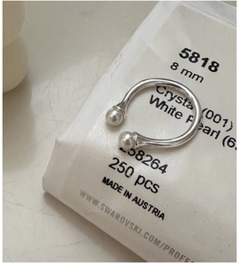 Macro shot of S925 sterling silver U-shaped open ring with two 8mm white pearls