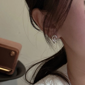 Minimalist S925 sterling silver conch spiral stud earrings on model for modern style