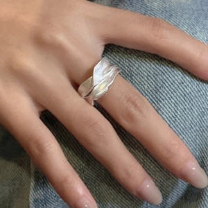 Minimalist S925 sterling silver ring featuring irregular matte textured folded leaf design