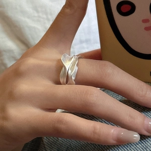 Minimalist S925 sterling silver ring with irregular wave design and matte texture finish