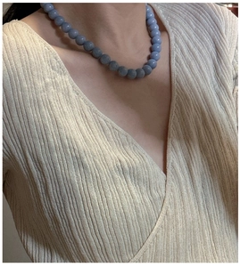 Detailed close-up of S925 sterling silver beaded necklace with matte grey-blue stones