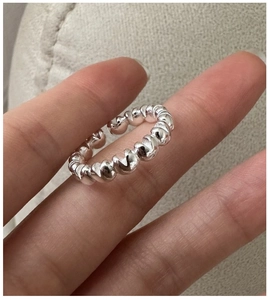 Macro shot of S925 sterling silver ring with spherical waves and adjustable opening