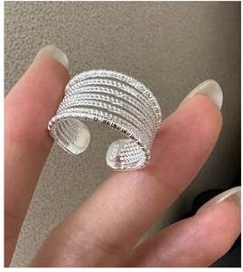 Detailed macro view of S925 sterling silver multi-layer wire band ring with hallmark
