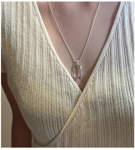 Detail of S925 sterling silver long O-chain necklace with irregular organic oval pendant