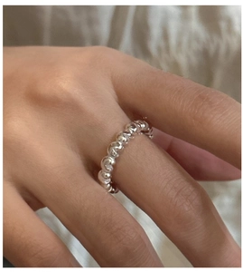 Detailed view of an S925 sterling silver beaded ring with a minimalist ball chain design