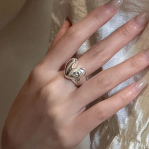 S925 sterling silver chunky heart ring with a polished finish worn on a finger
