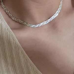 Elegant S925 sterling silver triple layered braided necklace shown on neck