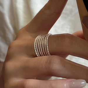 Minimalist S925 sterling silver multi-layered thin rings set with textured finish on model