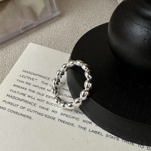 Minimalist S925 sterling silver ring featuring a unique beaded texture and glossy finish