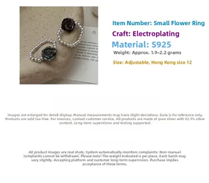 Close-up of S925 sterling silver beaded elastic ring with a black rose motif detail