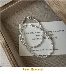 Macro detail of a 925 sterling silver beaded bracelet with fine textured finish