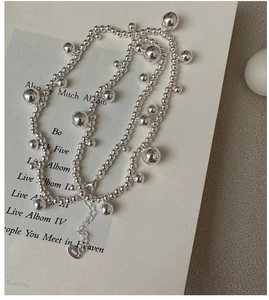 Detailed shot of S925 sterling silver beaded necklace with adjustable heart charm chain
