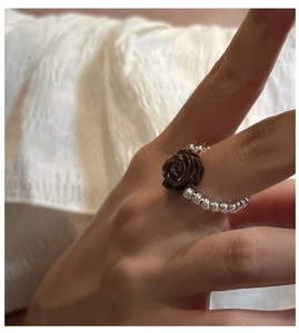 Detailed view of an S925 silver beaded ring featuring a retro dark rose flower charm