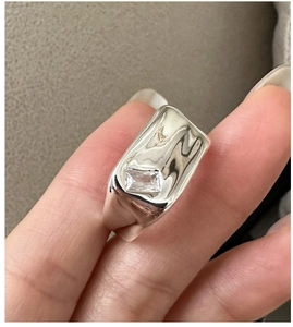 Detail view of S925 sterling silver liquid metal ring featuring a square zircon stone