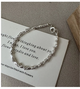 Detail of S925 sterling silver beaded bracelet with lobster clasp on vintage card