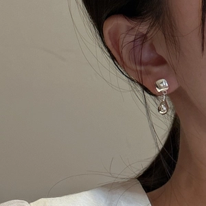 Minimalist S925 sterling silver geometric water drop earrings on a female model
