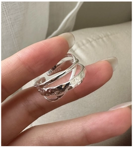 Detailed view of the S925 sterling silver ring featuring a layered cross design with lava texture