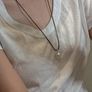Minimalist S925 sterling silver frosted sphere pendant on a thin black cord necklace