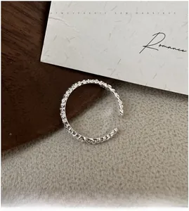Detail of S925 sterling silver ring with unique wrinkled texture and open adjustable band