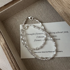 Elegant S925 sterling silver double chain bracelet with sparkling textured beads
