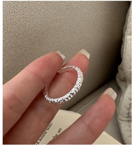 Close-up of S925 sterling silver ring with unique hammered texture and adjustable open band