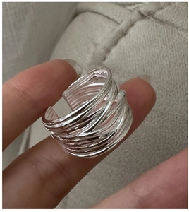 Detail of S925 sterling silver multi-layer wrapped wire ring with adjustable open design