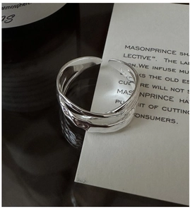 Macro detail of S925 sterling silver ring showing the hallmark and liquid metal texture
