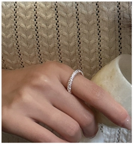 Detailed close-up of a S925 sterling silver pave ring with sparkling cubic zirconia stones