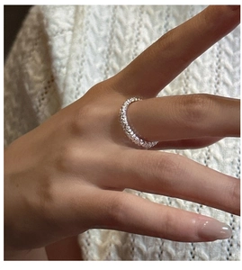 Detailed view of S925 sterling silver ring with unique textured surface on hand