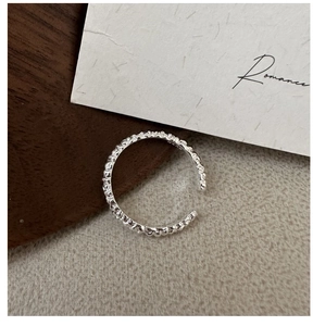 Detail of S925 sterling silver ring featuring a unique beaded texture and wavy surface