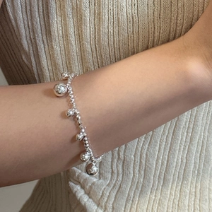 Minimalist S925 sterling silver beaded bracelet featuring multiple polished ball charms
