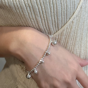 Minimalist S925 sterling silver beaded bracelet with five smooth spherical pendants on wrist
