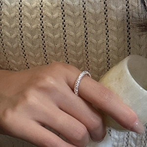 Minimalist S925 sterling silver eternity band ring with sparkling stones on model hand