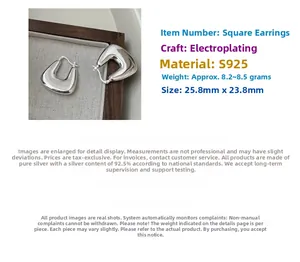 Detailed view of silver square hoop earrings made of S925 sterling silver with polished finish