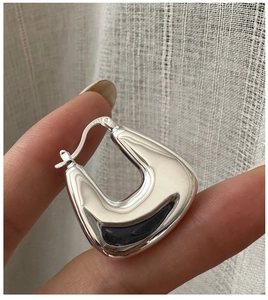 Detailed close-up of chunky 925 sterling silver square hoop earrings with S925 hallmark