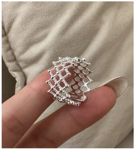 Macro shot of S925 sterling silver mesh ring with beaded texture and engraved hallmark